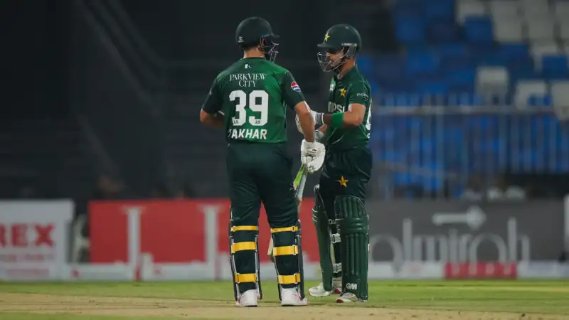 Saim Ayub celebrating his fiery 69, Hasan Nawaz smashing a six, Sharjah crowd roaring under floodlights.